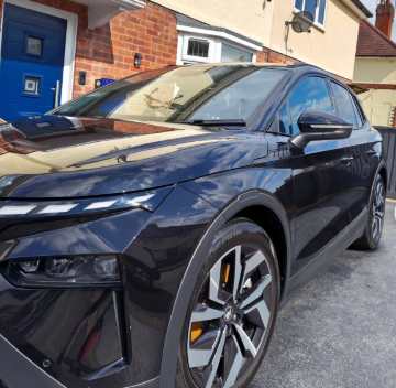 Detailed black saloon with mirror-gloss paintwork after a full valet